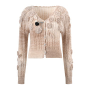 Pink knitted sweater with a three-dimensional floral design and cardigan sweater