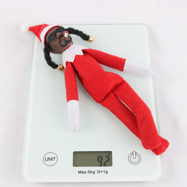 Resin doll peeks at bent Christmas elf doll, black felt doll Snoop on a Stoop